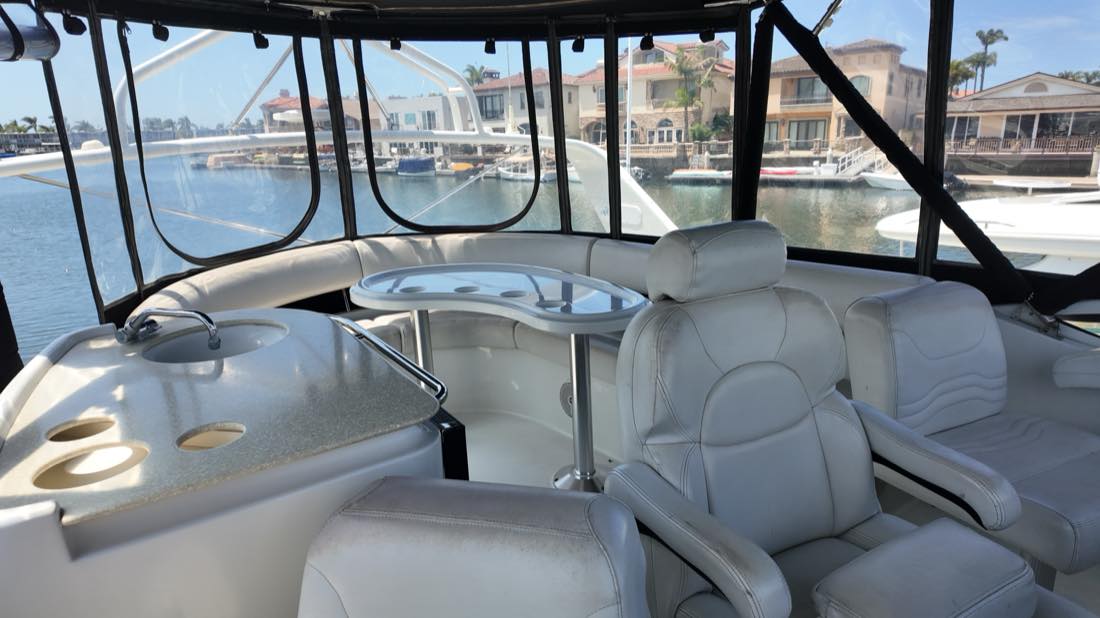 Flybridge seating and upper helm aboard Can't Sea Me